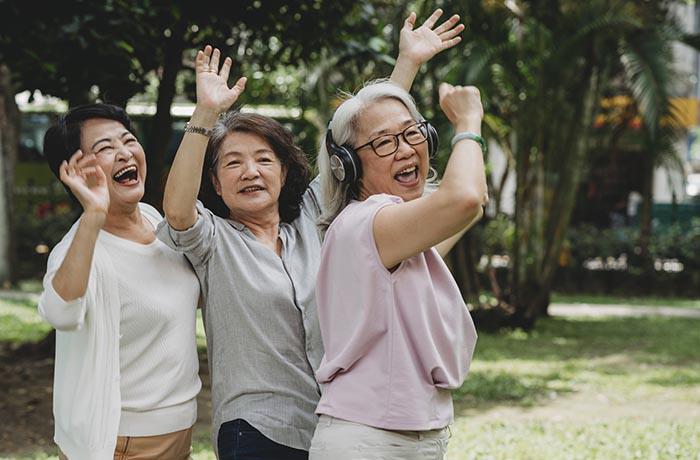 Three old women dancing